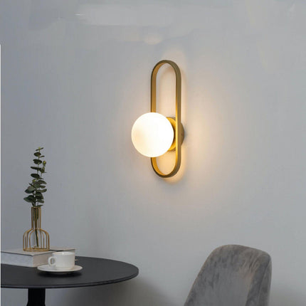 Applique da parete minimalista lampada da muro in metallo bronzo con sfera in vetro per camera da letto G9 - enzoled
