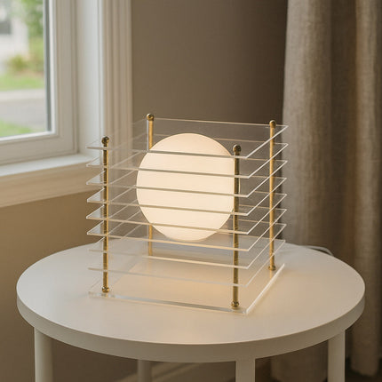 Lampada lume con sfera opalina e struttura trasparente finitura oro G9