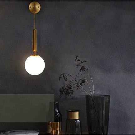 Applique a parete pendente in stile contemporaneo con attacco G9 di colore bronzo con sfera in vetro - enzoled
