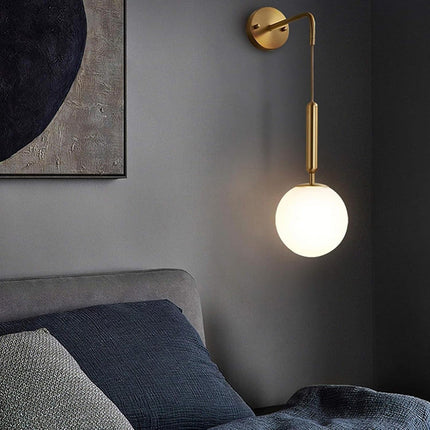 Applique a parete pendente in stile contemporaneo con attacco G9 di colore bronzo con sfera in vetro - enzoled